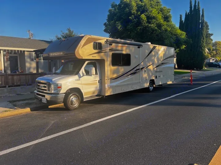 This clean Winnebago Minnie Winnie RV rental is parked on a sunny street, ready for your next adventure.. Winnebago Minnie Winnie 2017