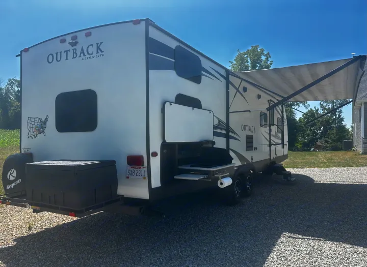 This Outback Ultra-Lite travel trailer RV rental features an outdoor kitchen, extended awning, and rear storage.. Keystone RV Outback Ultra-Lite 2018
