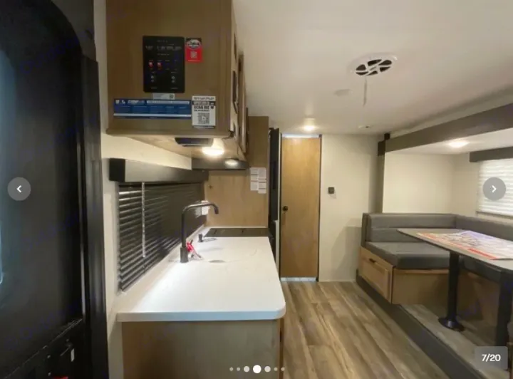 Explore this modern RV rental's spacious interior! Features a well-equipped kitchen and comfortable dinette for travel comfort.. Forest River Cherokee Wolf Pup 16KHWBL 2024