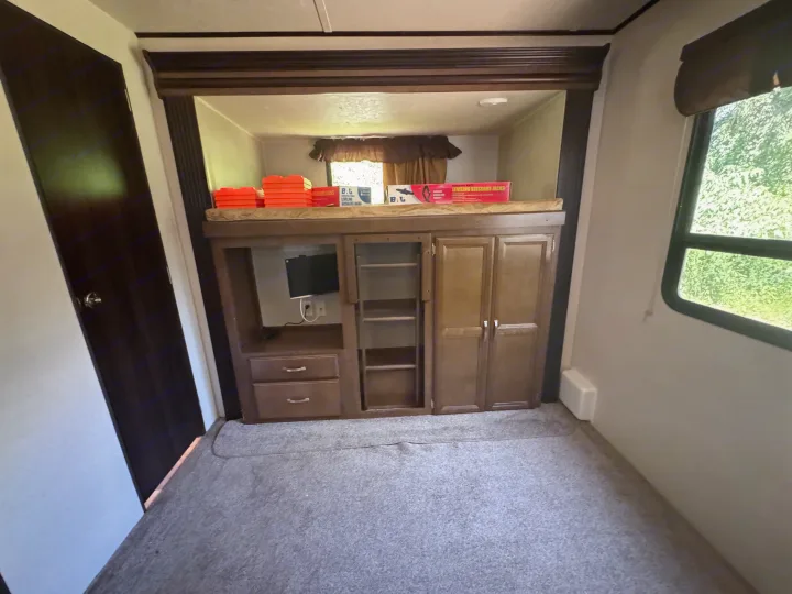 Cozy RV rental interior with bunk bed, TV, storage, and leveling jacks ready for adventure.. Forest River Salem Villa Classic Destination 2017