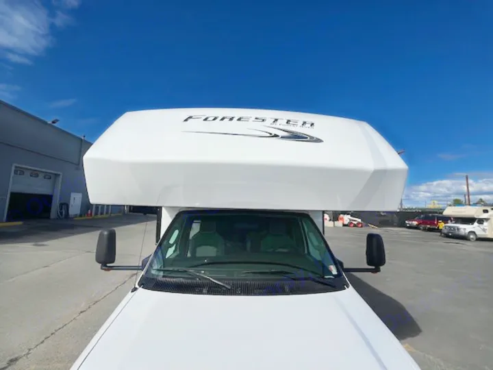 Front view of a white Forester Class C RV, an ideal rv rental for family travel. This motorhome is ready for adventure!. Forest River Forester 2022