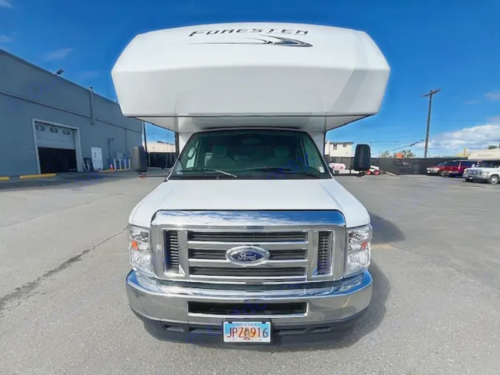 Front view of a white Ford Class C RV rental. Perfect for travel adventures!. Forest River Forester 2022
