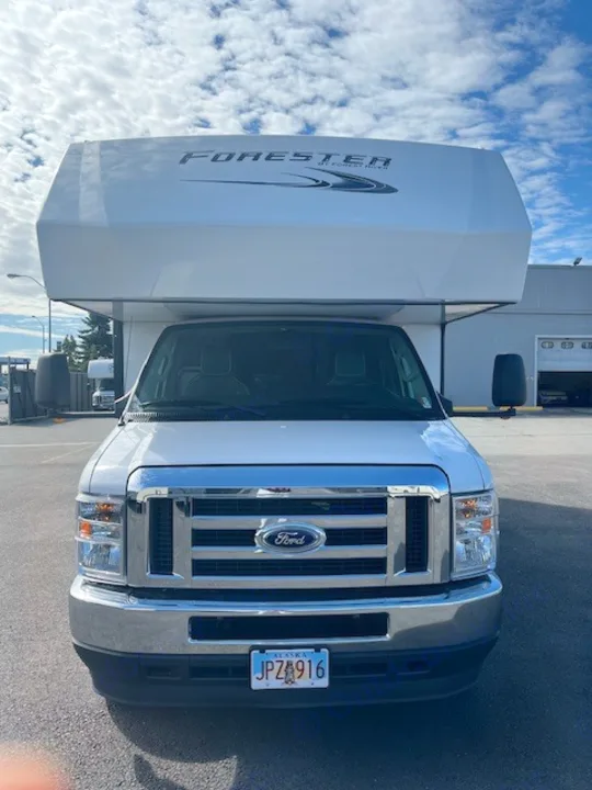 Front view of a white Ford Forester Class C RV rental. Ideal for your next motorhome adventure.. Forest River Forester 2022