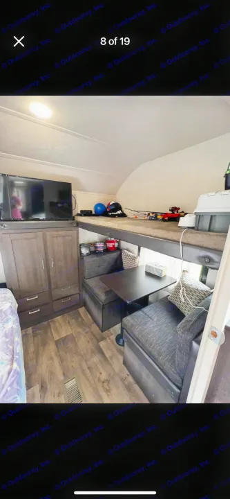 RV rental interior: bunk beds, dinette, TV, & wooden floor in this travel trailer. Perfect for getaways.. Forest River Salem 2018