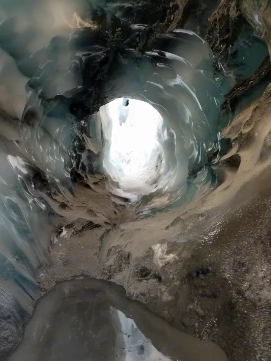 Inside a gleaming blue ice cave, a breathtaking natural tunnel. Plan your unique RV rental adventure!. Thor Four Winds 2019