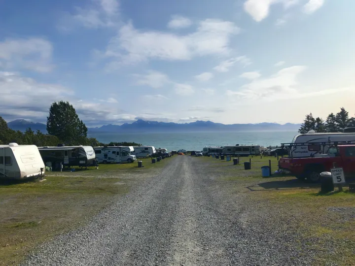 Scenic RV rental park with waterfront views of mountains and sea, perfect for coastal adventures.. Thor Four Winds 2019