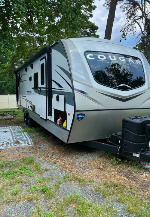 Explore the outdoors with this Cougar travel trailer, ideal for an RV rental camping experience.. Keystone RV Cougar 2023