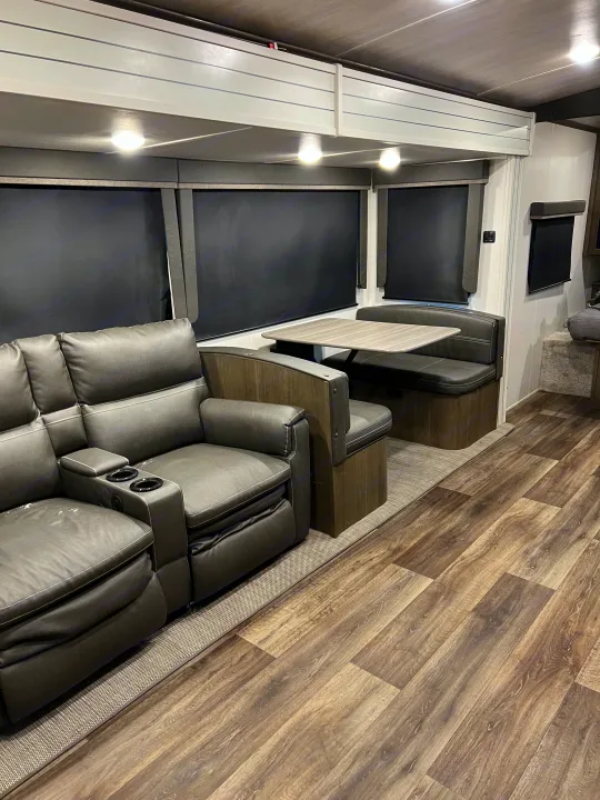 Step inside this modern RV rental: comfy recliners, a functional dinette, and wood-look flooring. Ready for your adventure.. Keystone RV Cougar 2023