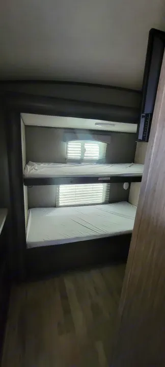 RV rental: Interior view of comfortable bunk beds, complete with clean mattresses and privacy blinds.. Heartland Sundance 2019