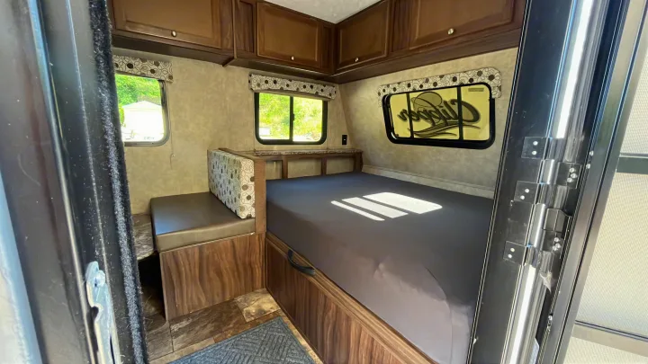 This RV rental offers a compact, functional interior with a comfortable bed, bench seating, and storage cabinets.. Clipper Clipper Trailer 2016