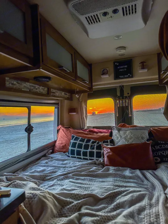 Experience an RV rental with this cozy interior & breathtaking beach sunset view. Adventure awaits!. Forest River Coachmen Crossfit 2018