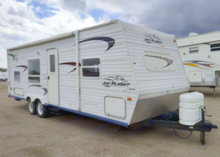 This white Jayco Jay Flight travel trailer is perfect for an RV rental. Ideal for camping trips and adventures.. Jayco Jay Flight 2005