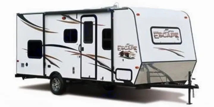 White travel trailer with 'Escape' branding, shown from the side. Ideal for an RV rental, offering comfort on the road.. Spree Escape 2016