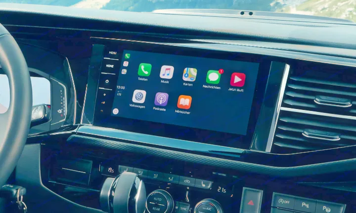 Modern Volkswagen RV rental interior: Apple CarPlay infotainment showing navigation, media, and phone apps for scenic journeys.. Volkswagen California T6.1 4MO 2024