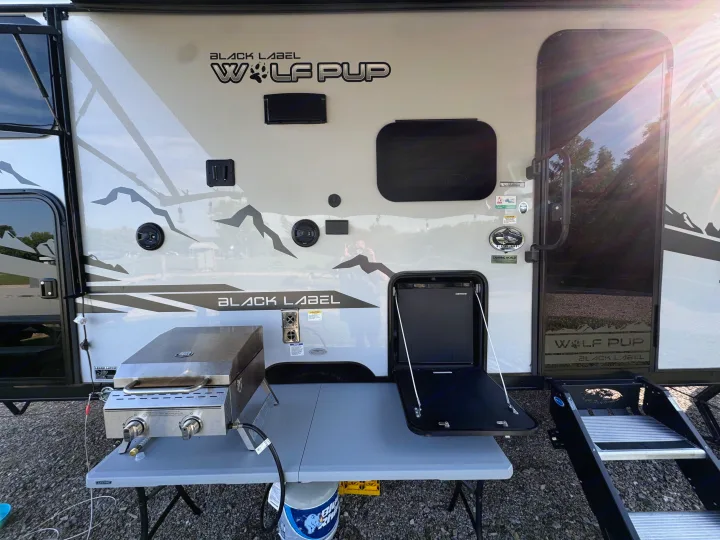 Wolf Pup Black Label RV rental with outdoor kitchen, grill, and fridge. Ready for camping adventures.. Forest River Cherokee Wolf Pup Black Label 2022