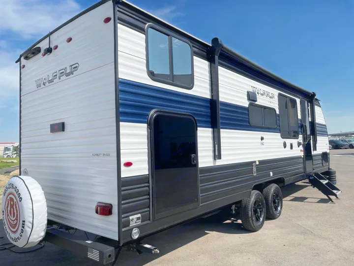 Rent this Forest River Wolf Pup travel trailer. A modern, white RV with blue accents, ready for your next adventure!. Forest River Cherokee Wolf Pup 2023