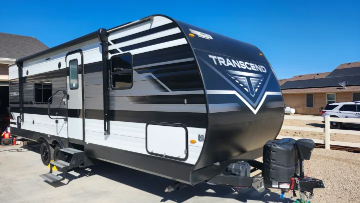 Modern black, white, and gray Transcend Xplor travel trailer, ideal for your next RV rental road trip.. Grand Design Transcend Xplor 2022