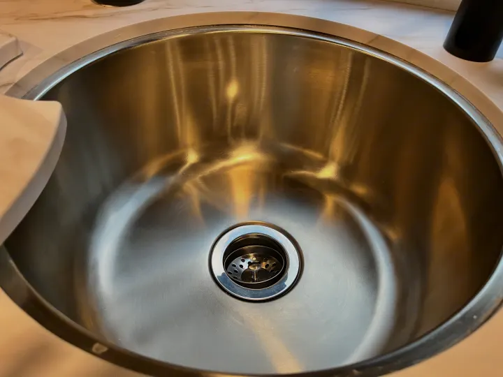 Clean, modern stainless steel kitchen sink and drain in an RV rental. Ready for your travels.. Forest River Solera 27 DSE 2023