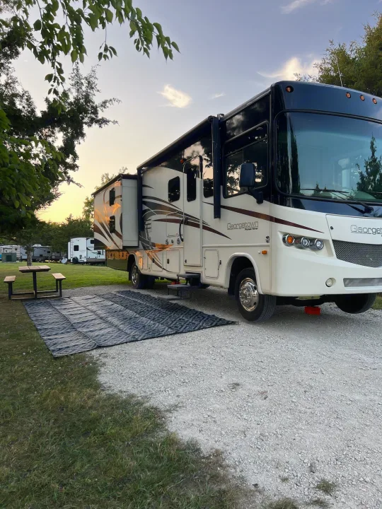 Spacious RV rental at a scenic campground. This motorhome campsite features an outdoor mat, picnic table, and extended slide-out.. Georgetown Georgetown Motorhome 2016