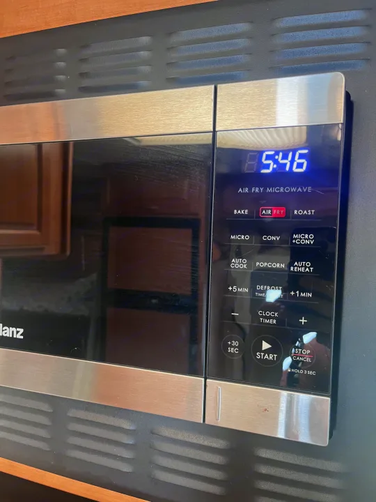 RV rental: Air fry microwave with digital display (5:46) and cooking controls in an RV kitchen.. Four Winds Chateau 2011