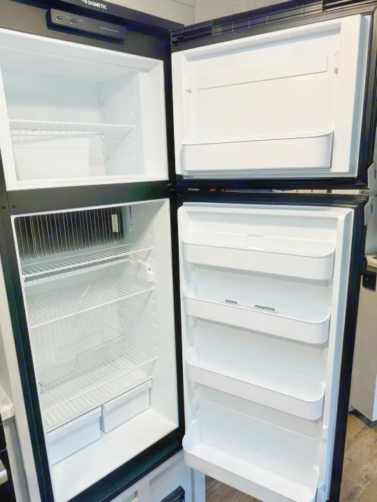 Spacious, empty Dometic RV refrigerator & freezer, ideal for your rv rental. Prepped for your camping food.. Forest River Vibe 2021