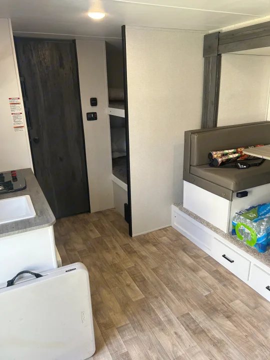 This RV rental offers a compact interior with kitchen, bunk beds, dinette, and ample storage for travel.. Keystone RV Hideout 2022
