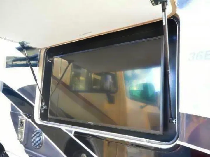 RV rental with an outdoor TV visible in its side compartment, held open by struts. Perfect for outdoor entertainment.. Georgetown GT5 2019
