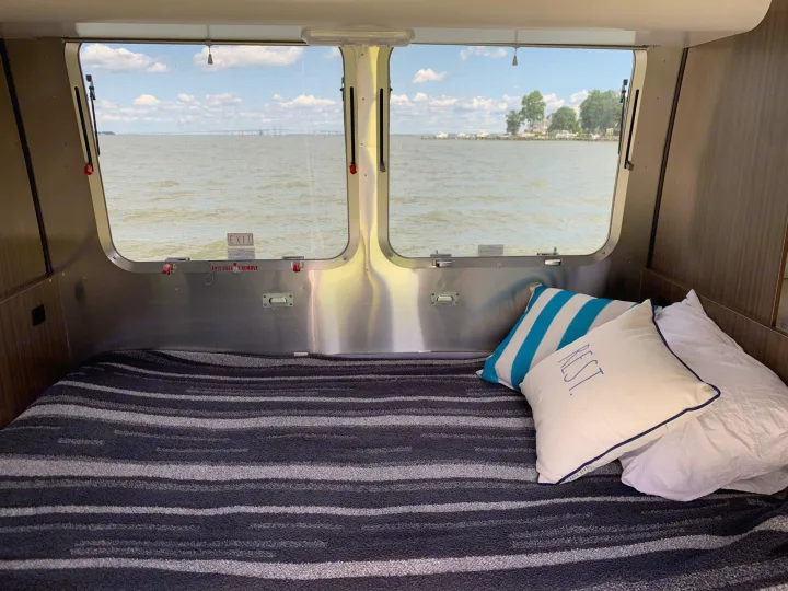 Relax in this cozy RV rental with a comfortable bed & scenic waterfront views, including a distant bridge. Ideal for travel.. Airstream Caraval 2021