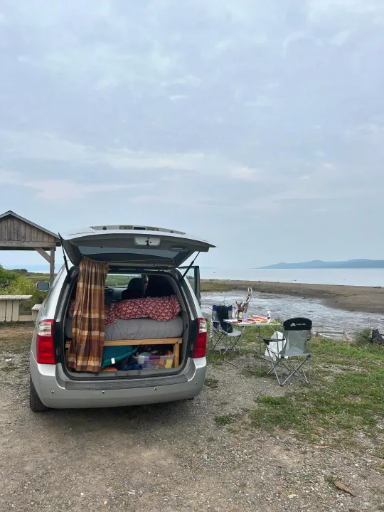 DIY car camping setup by the water, a flexible rv rental alternative for scenic outdoor adventures.. KIA SEDONNA 2008