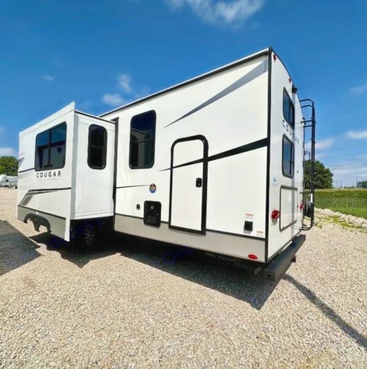 This spacious white Cougar RV with its extended slide-out is ready for your next rv rental trip on the open road.. Keystone RV Cougar 2024
