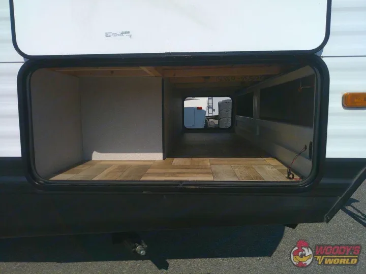 Spacious RV pass-through storage, ideal for an RV rental. Features wood-look floor and ample space for gear.. Forest River Shasta 2022