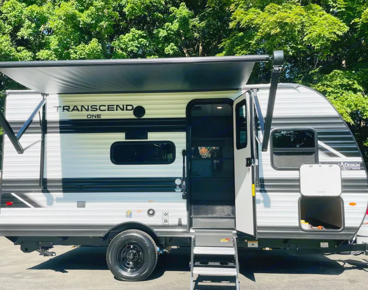 RV rental: A modern travel trailer with awning extended and door open, ready for adventure.. Grand Design Transcend One 151BH 2025