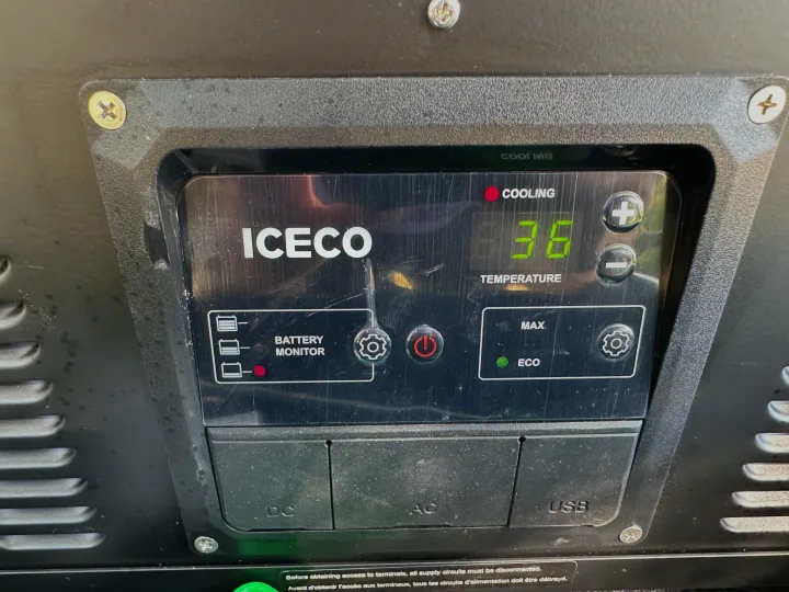 ICECO portable fridge/freezer control panel, perfect for an RV rental. Displays 36°F, cooling mode, and battery levels.. Opus Camper Opus OP4 2024