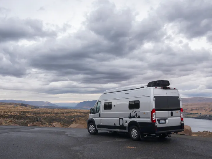 Perfect RV rental for scenic adventures: a silver Winnebago Solis parked at an overlook with valley views.. Other Other 2022