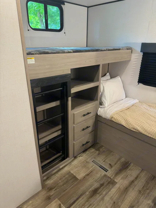 Experience comfort in this RV rental with bunk beds, a lower bed, and smart storage, ideal for families.. Coleman Lantern 334BH 2024