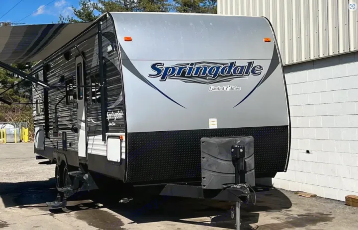 Explore the outdoors! This grey and black Springdale Limited Edition travel trailer is ideal for an RV rental or camping trip.. Keystone Springdale 2016