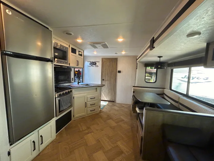 Spacious RV rental interior with modern kitchen, dinette, and comfortable living space. Perfect for your next adventure.. Palomino Puma 2022