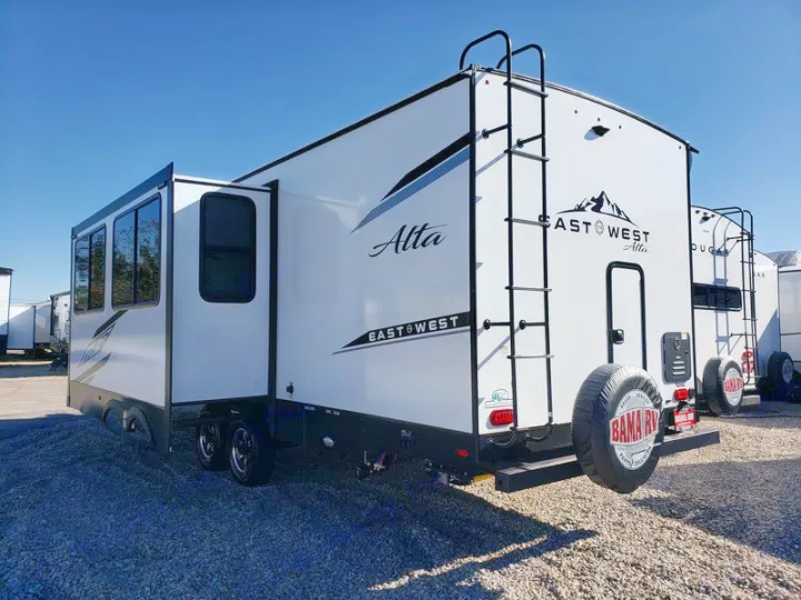 Spacious white East West Alta travel trailer, perfect for your next rv rental adventure. Features a slide-out and rear ladder.. East to West Alta 2024