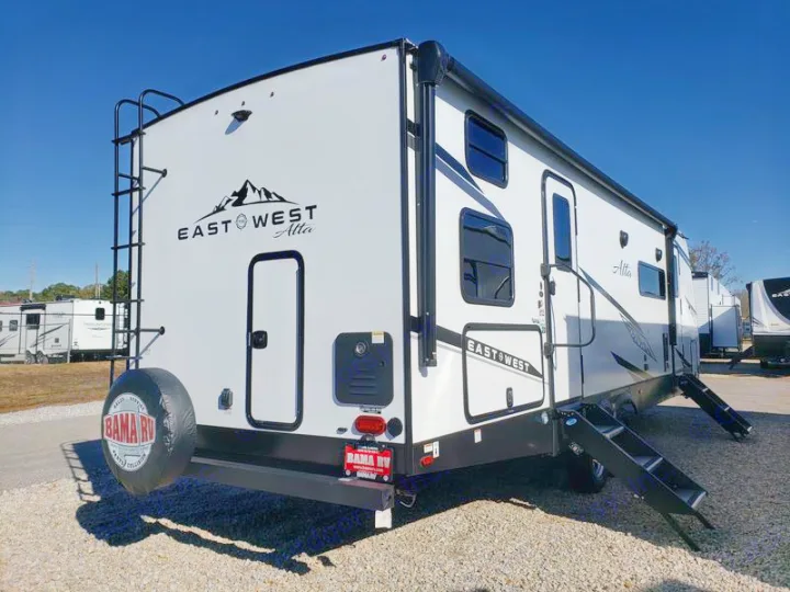 This white East West Alta travel trailer RV rental, with a rear ladder and extended steps, is ready for your trip.. East to West Alta 2024