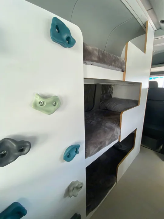 This rv rental features fun bunk beds with cozy blankets & a colorful indoor climbing wall.. Mercedes-Benz Sprinter 2014