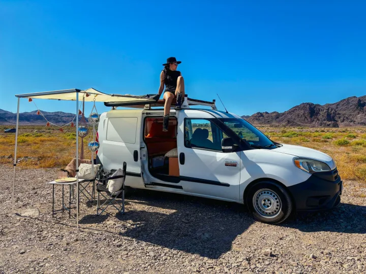 Explore the desert in this RV rental van! Featuring an awning, outdoor chairs, and a rooftop spot for a traveler.. Dodge Promaster City 2016