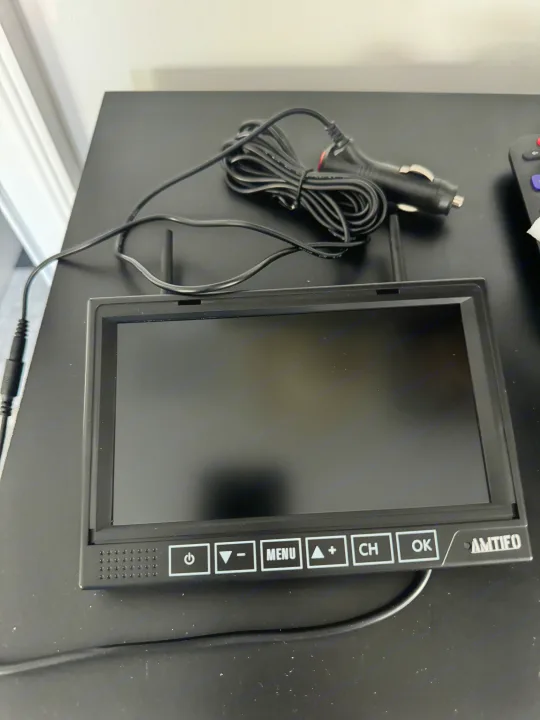 AMTIFEO portable car monitor with controls & 12V power cable, suitable for RV rental vehicles.. Sunset Park RV Sun Lite LTD 2024