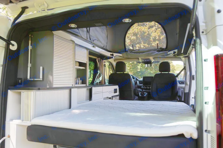 Spacious rv rental camper van interior. Features bed, kitchen, storage, and pop-top for travel adventures.. HANROAD TREK 5 2026
