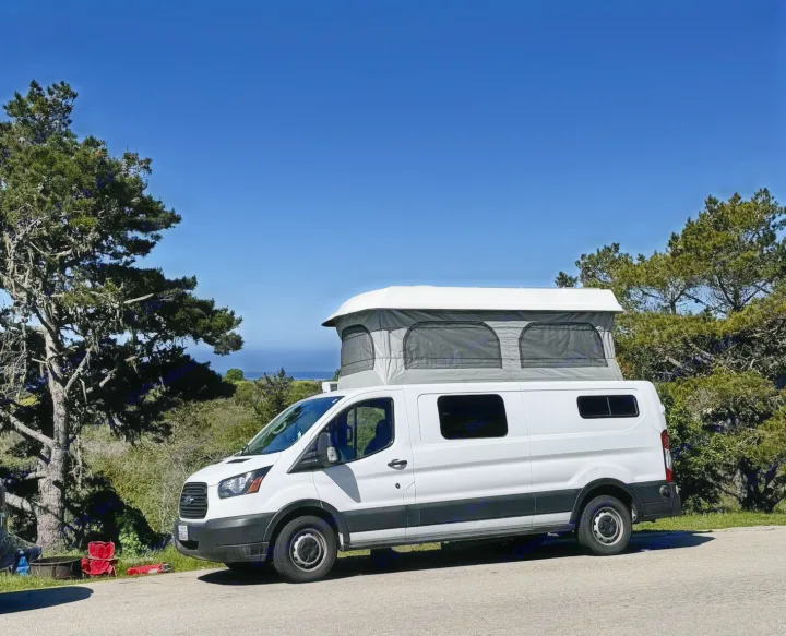 White pop-top campervan, great RV rental, parked with ocean views. Ideal for a scenic road trip or camping.. Ford Transit Custom 2019