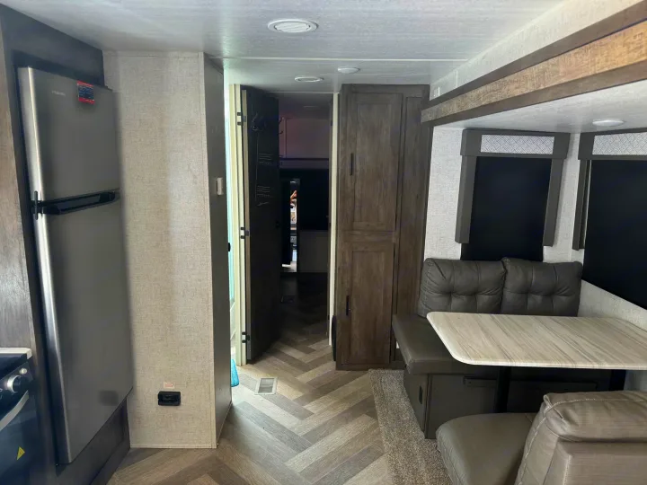 Spacious RV rental interior featuring a kitchen, dinette, and ample storage, ideal for comfortable travel.. Forest River Other 2021