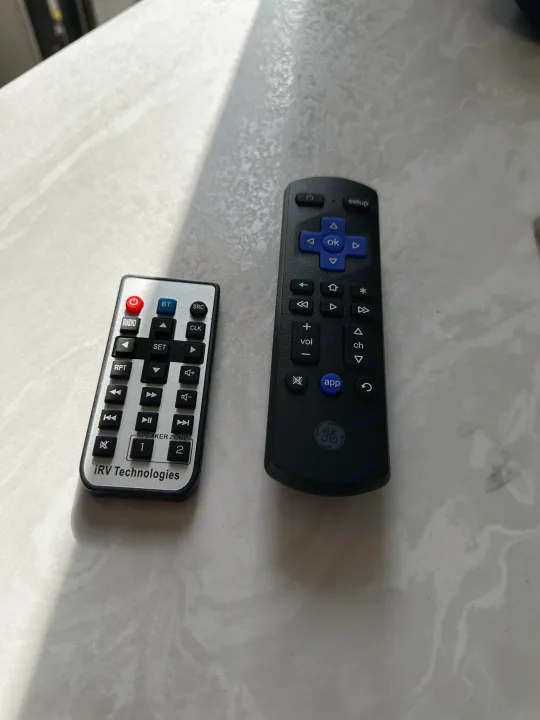 Two remotes for your RV rental: an iRV entertainment system control and a GE universal remote.. Jayco Jay Flight 2024