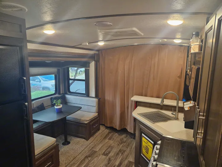 Step inside this **rv rental**! Features include a functional kitchen, comfy dinette, and bright living space. Perfect for trips.. Keystone RV Cougar 2019