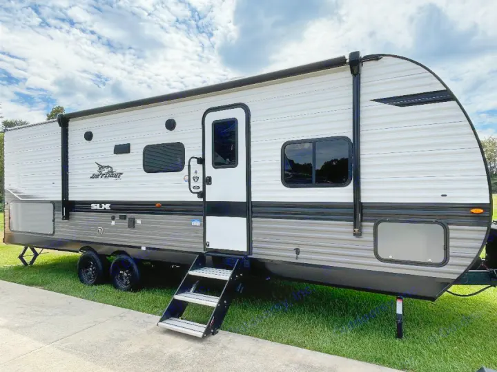 Modern grey & white travel trailer, ideal for an RV rental. Steps down for easy access.. Jayco Jay Flight SLX 2024