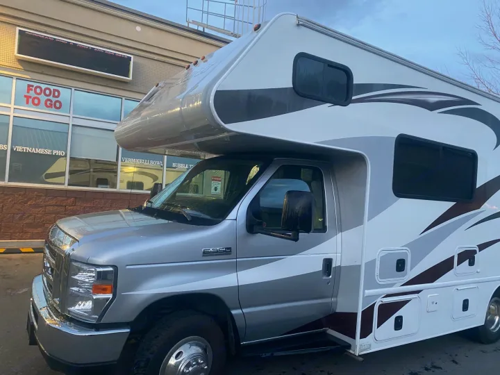 Silver and white Class C **RV rental** on Ford E-series chassis, parked and ready for your next road trip adventure.. Adventurer Adventurer Motorhome 2017