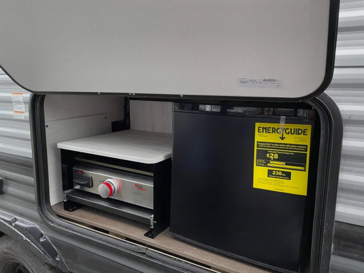 This RV rental features a practical outdoor kitchen with an EverChill mini-fridge and Suburban griddle.. Forest River Salem Cruise Lite 2022